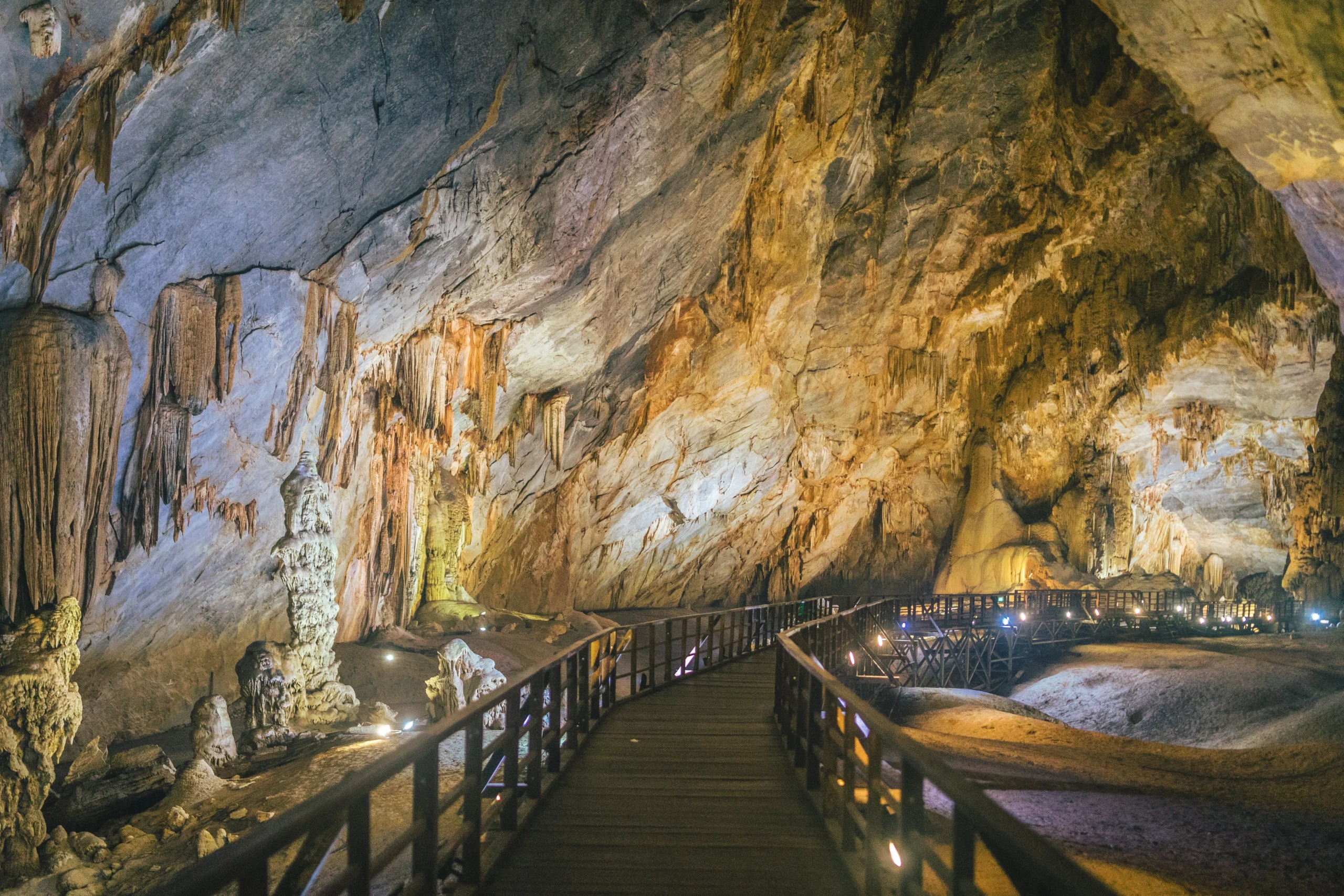 boardwalk-through-lit-paradise-cave-vietnam_11zon